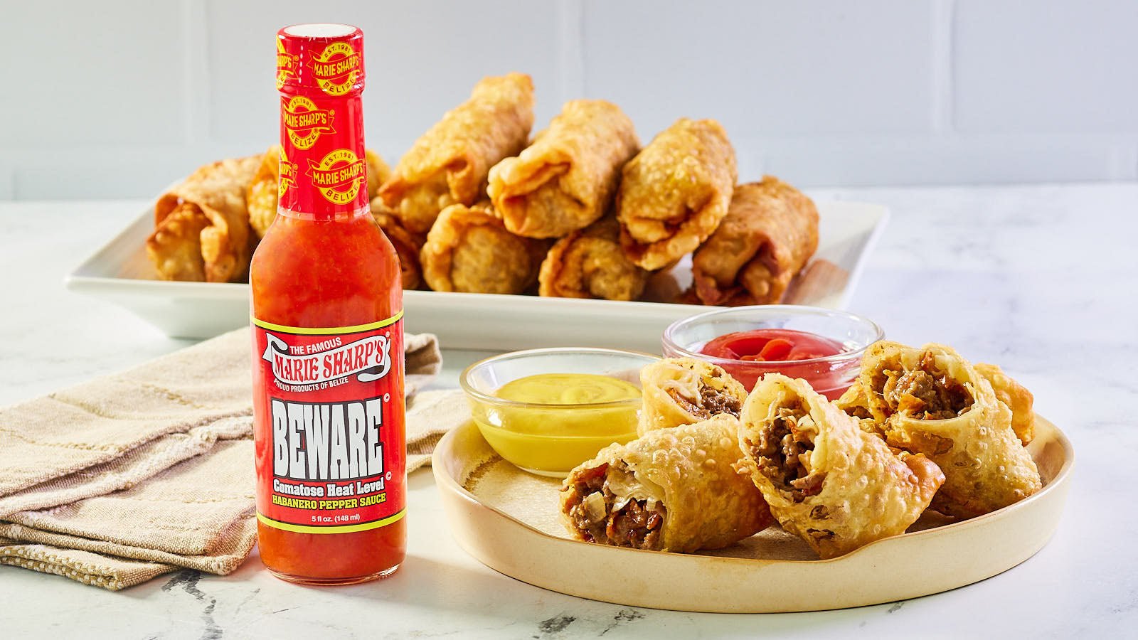 Cheeseburger Egg Rolls with Marie Sharp’s Beware Comatose Level Habanero Pepper Sauce - The Pepper Pantry (Formerly Marie Sharp's)