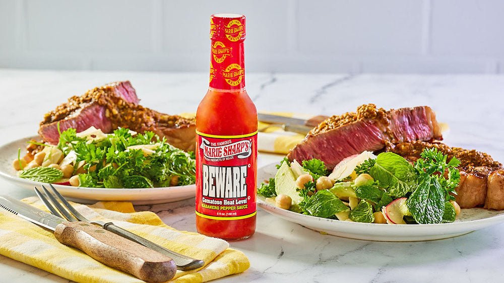 Rib-eye with Pesto Butter and Herb Salad and Marie Sharp’s Beware Comatose Habanero Pepper Sauce - Pepperheadz Company Store